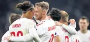  ??  ?? WINNERS Denmark clinched top spot by beating Wales