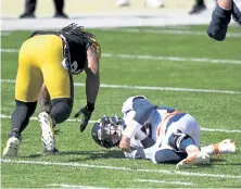  ?? Andy Cross, The Denver Post ?? Denver quarterbac­k Drew Lock grimaces after getting tackled by Pittsburgh outside linebacker Bud Dupree in the first quarter of Sunday’s game in Pittsburgh.