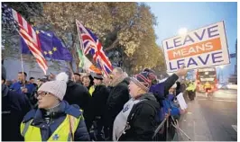  ?? MATT DUNHAM/AP ?? Supporters and opponents of Brexit protest Thursday near Parliament in London.