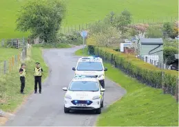  ?? ?? Call-out Police at the scene of the grenade discovery in Doune