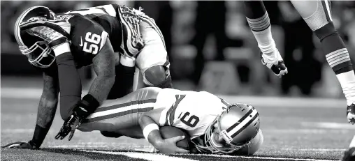  ??  ?? Washington Redskins inside linebacker Perry Riley sacks Dallas Cowboys quarterbac­k Tony Romo during the first half Monday in Arlington, Texas.