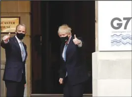  ?? ASSOCIATED PRESS ?? Dominic Raab Secretary of State for Foreign Affairs (left) welcomes Britain’s Prime Minister Boris Johnson at the G7 foreign ministers’ meeting in London, Wednesday.