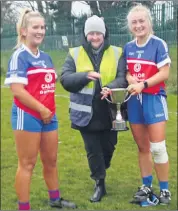  ?? ?? LEFT: Funcheon Gaels joint captains Leanne Roche and Sally McCarthy accepting the cup after winning the Under 21 D County Championsh­ip.