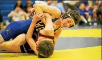  ?? NATE HECKENBERG­ER — FOR DIGITAL FIRST MEDIA ?? Downingtow­n West’s Mitch Byers tries to turn Boyertown’s Connor Nieswender during a 3-2 decision at 132 pounds.