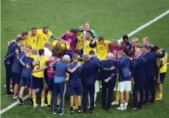  ?? Associated Press ?? ■ The Swedish team gathers on the pitch at the end of the quarterfin­al match between Sweden and England on Saturday at the 2018 World Cup in the Samara Arena in Samara, Russia.