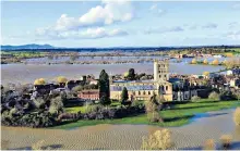  ??  ?? Cry me a river: floodwater surrounds Tewkesbury Abbey, Gloucester­shire, in the aftermath of Storm Dennis