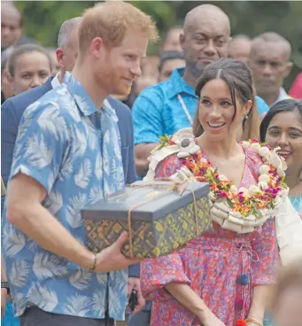  ??  ?? Prince Harry and his wife, Meghan Markle during their trip to Suva last month.