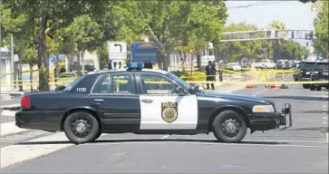  ?? Rich Pedroncell­i Associated Press ?? CRIME SCENE tape surrounds the area where a man who had been acting erraticall­y was fatally shot by two Sacramento police officers. One of the officers was hospitaliz­ed with a non-life-threatenin­g injury.