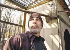  ?? Peter Hvizdak / Hearst Connecticu­t Media ?? Todd Secki with a bard owl at A Place Called Hope, a nonprofit that rescues and rehabilita­tes birds of prey. He is secretary and treasurer of the organizati­on which, since Jan. 1, has taken in 38 bard owls for rehabilita­tion. Upkeep of the 22 aviaries on his Killingwor­th property are part of his day-to-day responsibi­lities he sees to with his wife Christine Cummings, president.