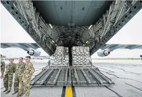  ?? JON CHERRY GETTY IMAGES ?? Pallets in the cargo bay of a U.S. Air Force C-17 carrying 78,000 pounds of Nestlé Health Science Alfamino Infant and Alfamino Junior formula from Europe arrive at Indianapol­is Airport on Sunday.