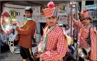  ?? AP/RAJESH KUMAR SINGH ?? A brass band waits Saturday to welcome Rahul Gandhi, vice president of India’s ruling Indian National Congress party, as he arrives to file his nomination for the ongoing general elections in Amethi, India.