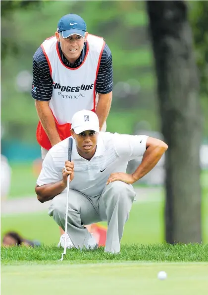  ?? Photo / Photosport ?? Tiger Woods won 72 titles, including 13 majors, during the 13 years Kiwi Steve Williams was his caddie.