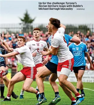  ?? SPORTSFILE ?? Up for the challenge: Tyrone’s Declan McClure leaps with Dublin’s Michael Darragh Macauley
