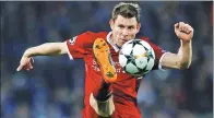  ?? LEE SMITH / ACTION IMAGES VIA REUTERS ?? James Milner of Liverpool in action against Porto on Tuesday.