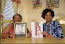  ?? JUAN LOZANO — THE ASSOCIATED PRESS ?? In this Wednesday photo Mylinda Byrd Washington, 66, right, and Louvon Byrd Harris, 61, hold up photograph­s of their brother James Byrd Jr. in Houston.