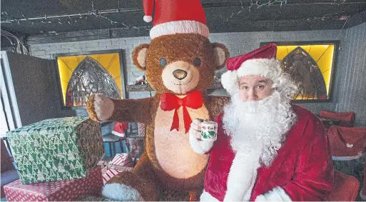  ?? RICK MADONIK PHOTOS TORONTO STAR ?? Nick Kennedy (as Santa) and his partner, Lauren McKenna, will open a pop-up Christmas bar on Friday to raise funds for charity and add to the holiday spirit.