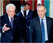  ?? —AFP ?? italian President Sergio Mattarella (left) welcomes Carlo Cottarelli at the Qurinale presidenti­al palace in rome, itlay.