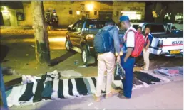  ??  ?? This picture collage shows police officers enforcing the ban on illegal vendors along Simon Muzenda Street (formerly Fourth Street) in Harare yesterday afternoon and a policeman buying a trousers from an illegal vendor on his way home after work in the...