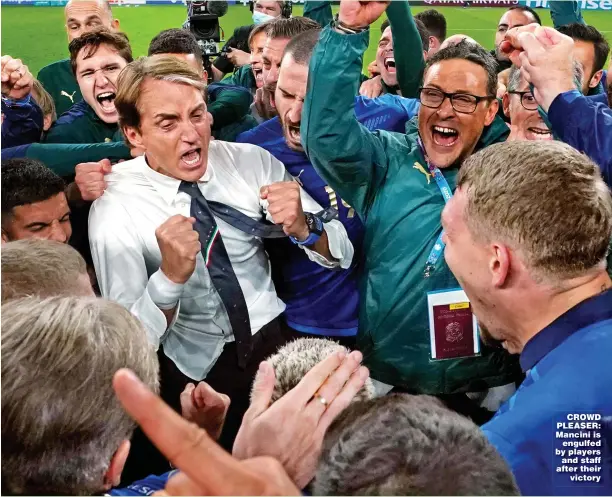  ??  ?? CROWD PLEASER: Mancini is engulfed by players and staff after their victory