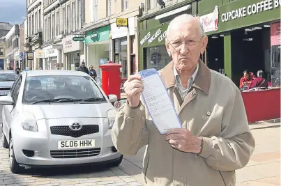  ?? Picture: Gareth Jennings. ?? Tom Barnes with his parking ticket.