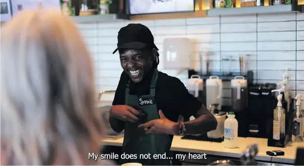  ?? Photo: Supplied ?? A lovely reaction from a Starbucks employee as Tessa speaks Xhosa to him. (He said ‘uncumo lwam alupheli’ – my smile does not end.)