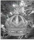  ?? Courtesy of Marni Jameson. ?? This crown ornament, which the author and her husband picked up on a trip to England’s Tower of London, forms the foundation for a tree that will evolve over years to reflect their newly blended family, travels and passions.