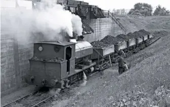  ?? COLOUR RAIL ?? RIGHT Having built up a good head of steam, Robert prepares to take a load of ironstone from the 3ft gauge quarry railway above to the BR exchange sidings at Lamport.