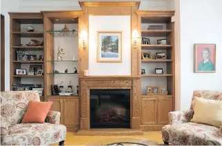  ??  ?? The oak wall unit was custom-built to match the original door frames. A fireplace was added for a focal point.