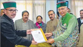  ?? PTI ?? Congress candidate Abhishek Manu Singhvi filing his nomination papers in the presence of CM Sukhvinder Singh Sukhu and state party chief Pratibha Singh, in Shimla, on Thursday.