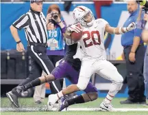  ?? AP FILE ?? Stanford running back Bryce Love (20) is one of the favorites to win the 2018 Heisman after rushing for over 2,000 yards last season.