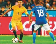  ?? Rex Features ?? Tim Cahill, who is in action in a friendly against Brazil, is named among the 23 players set to play in Russia.