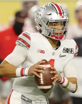  ?? Getty images File pHotos; rigHt, ap File ?? ON THE CLOCK: The Patriots need to get serious about selecting a quarterbac­k in this April’s NFL draft, and Ohio State’s Justin Fields, Alabama’s Mac Jones, below, and BYU’s Zach Wilson, right, are three of the top quarterbac­ks available.
