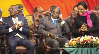  ?? — Picture: Believe Nyakudjara ?? President Mugabe and First Lady Amai Grace Mugabe share a lighter moment while flanked by the incoming Child President Takudzwa Mhuru at the official opening of the Junior Parliament and Day of the African Child commemorat­ions at the City Sports Centre in Harare yesterday.