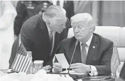  ??  ?? President Trump listens to Secretary of State Rex Tillerson at a meeting in Riyadh, Saudi Arabia, in May. MANDEL NGAN/ AFP/GETTY IMAGES