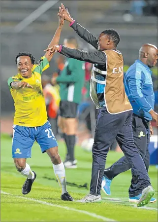  ?? Picture: GALLO IMAGES ?? BIG HERO: Mamelodi Sundowns’ Percy Tau, left, celebrates his goal during the CAF Champions League semifinal second leg match against Zesco United played at the Lucas Moripe Stadium on Saturday night
