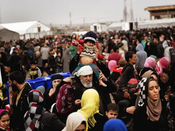  ??  ?? Displaced Iraqis from Mosul arrive at the Hamam al-Alil camp during the government forces’ ongoing offensive to retake the western parts of the city from Isis fighters (Getty)