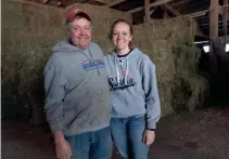  ??  ?? Marty Nigon is shown with his daughter, Kristyn, on their family’s farm on Oct. 10 in Greenwood. Kristyn, who graduated from UW-River Falls in May, works at an implement dealer in Durand, but frequently comes back to
work weekends.