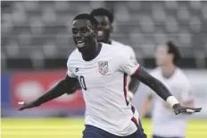  ?? FERNANDO LLANO/AP ?? UNITED STATES’ TIM WEAH CELEBRATES scoring his side’s opening goal against Jamaica during a qualifying soccer match for the FIFA World Cup Qatar 2022 in Kingston, Jamaica Tuesday.