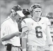  ?? Wally Skalij
Los Angeles Times ?? LANE KIFFIN, left, was only the first of four coaches who mentored quarterbac­k Cody Kessler at USC.
