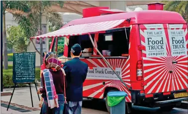  ??  ?? (Above) The Lalit Food Truck Company at Delhi’s Barakhamba Road; (below) Frugurpop, a first-of-its-kind ice cream van in Gurgaon.