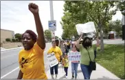  ?? ?? Kamilah Miller, left, and others take part in a march after a tenants' rights rally at the Delta Pines apartment complex in Antioch on Wednesday.
