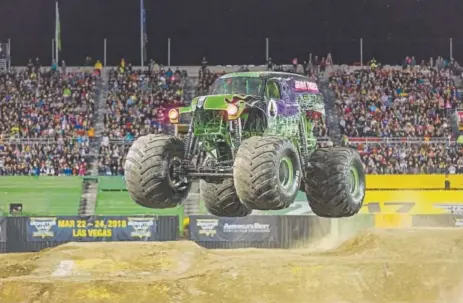  ?? Provided by Monster Jam ?? Krysten Anderson isn’t the only driver of Grave Digger. On any given weekend, more than a half-dozen Monster Jam shows feature the distinctiv­ely neon-green-and-black truck, including one driven by her boyfriend, Tyler Menninga.