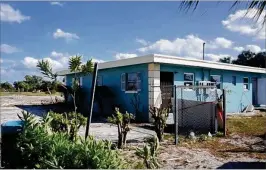  ??  ?? Gail and Leon Jenkins put in $19,000 to fix this property in Boynton Beach. Their neighbors and friends also contribute­d money. The building was demolished by the city in 2015.