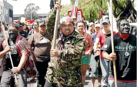  ?? DAVID WHITE/STUFF ?? Tu¯ hoe protesters march in Auckland in 2007 against earlier police terror raids in Te Urewera.