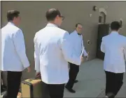  ??  ?? Brian Sikes (from left), as Frankie, Todd Williams, as Smudge, James Swendsen, Jinx, and Kevin Garland, as Sparky, walk down the sidewalk on Sixth Avenue practicing the singing numbers in the musical “Forever Plaid” before the start of the last showing...