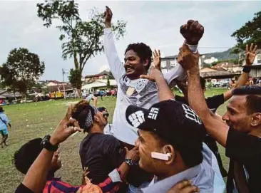  ?? AFP PIC ?? Rohingya players from the Selangor team and supporters celebratin­g after winning the football finals against Cheras Harimau in Kuala Lumpur.