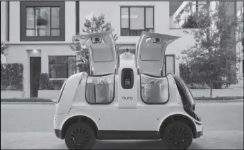  ?? ASSOCIATED PRESS ?? This undated image provided by Nuro in February 2020 shows their self-driving vehicle “R2” carrying bags of groceries.