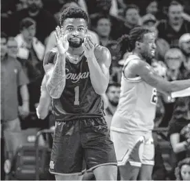  ?? Brett Coomer/staff photograph­er ?? Houston guard Jamal Shead reacts during the second half against Tulane on Wednesday. The Cougars won their eighth straight and their 17th of the last 18.