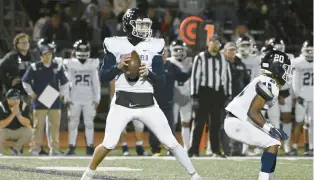  ?? JESSICA HILL/SPECIAL TO THE COURANT ?? Wethersfie­ld quarterbac­k Cam Righi looks to throw during a game on Friday at Hall High School in West Hartford.