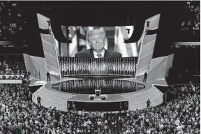  ?? [PATRICK SEMANSKY/ASSOCIATED PRESS] ?? A smiling Donald Trump addresses delegates during the July 2016 Republican National Convention in Cleveland. This year’s convention for his re-election likely will be much different because of the pandemic.